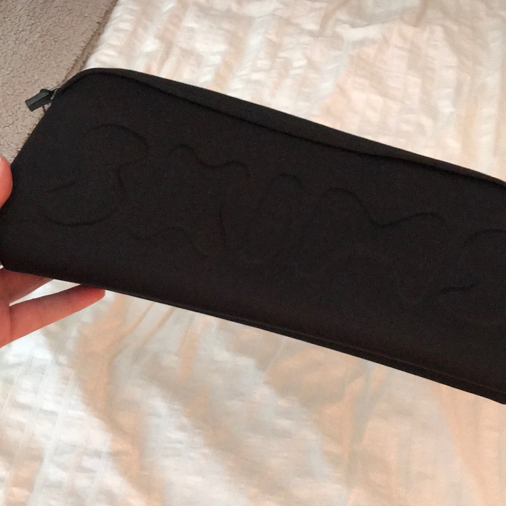 Skims black neoprene pouch